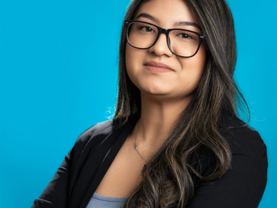 Photo of team member Michelle Arroyo smiling and posing for a photo